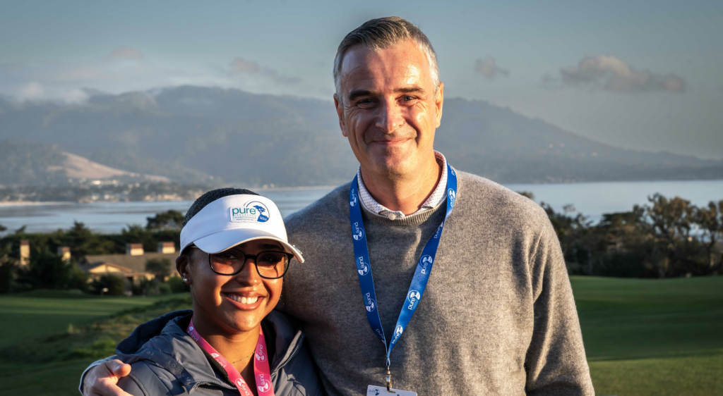 Nyah Roccamonte-Clark and Martin Leitch of PURE Insurance pose for a photo during the PURE Insurance Championship